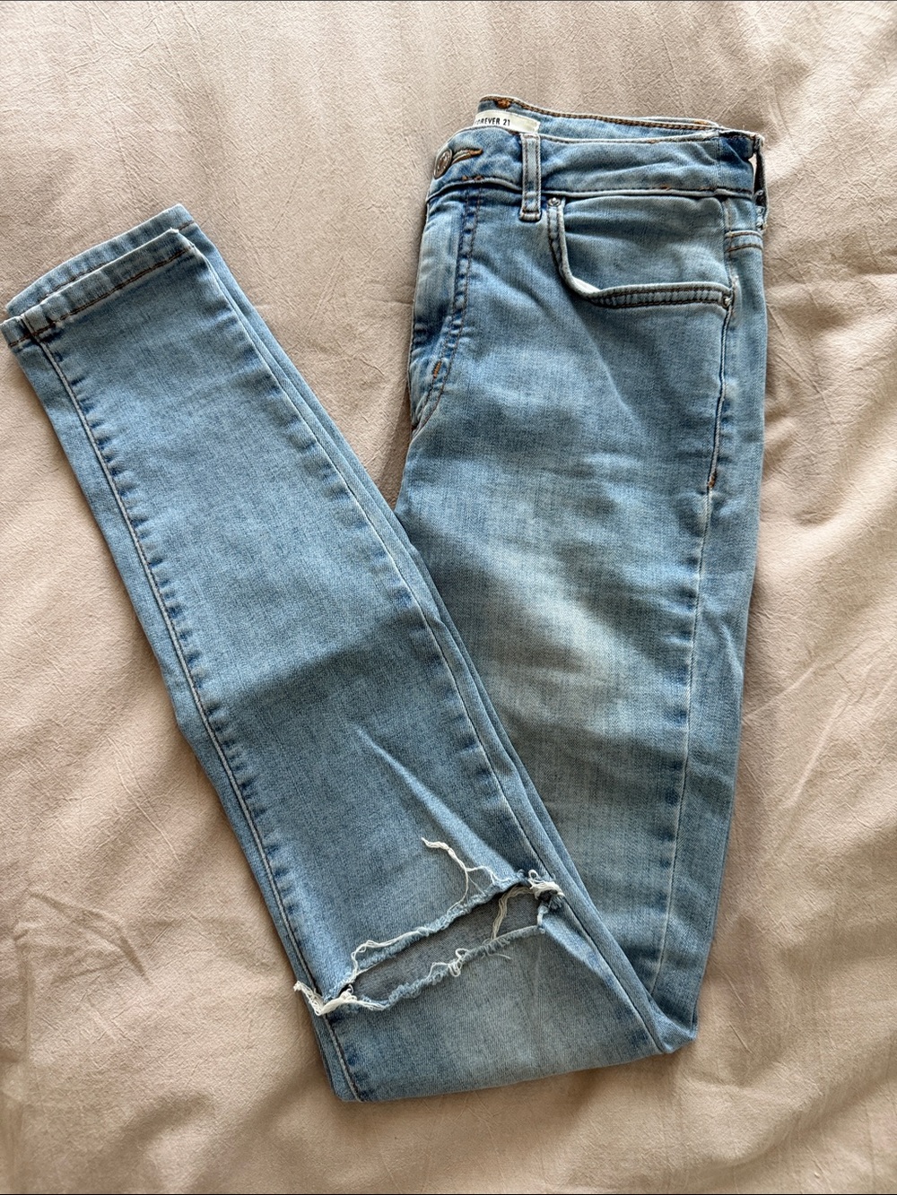 Forever 21 Light Blue Skinny Jeans with Knee Distress